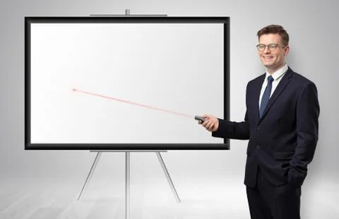 Businessman with laser pointer and copyspace white wall Stock Photos