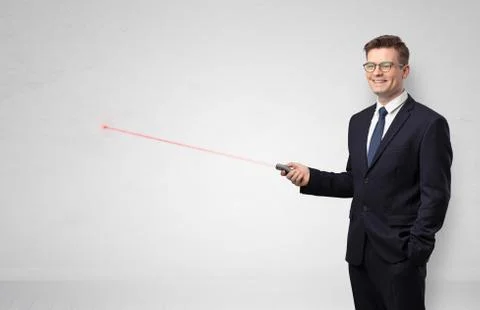 Businessman with laser pointer and copyspace white wall Stock Photos
