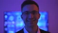 The businessman laughing in the dark room 4k or 4k+ Resolution