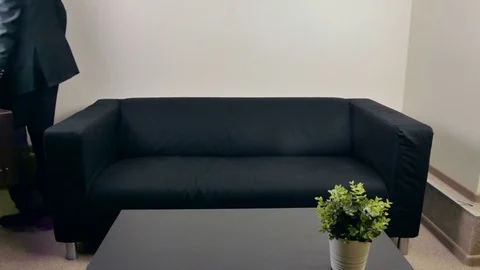 Businessman lay on the sofa Stock-Footage 80125027