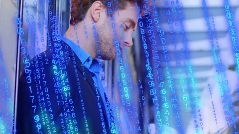 Businessman leaning on column, tapping tablet and generating blue code overlay Stock Footage 334351539