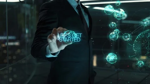 Businessman with Let's Get Started hologram concept Stock Footage 119549254