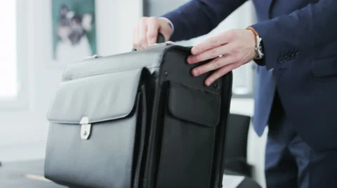 Businessman lifting his briefcase. Stock Footage 68396122