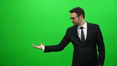 Businessman Lifting Or Presenting Something on Green Screen. Right Side. Stock Footage 88651675