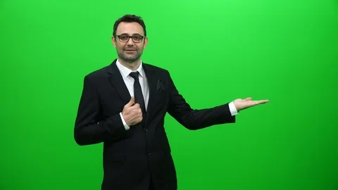 Businessman Lifting Or Presenting Something on Green Screen. Left Side. Stock Footage 88651684