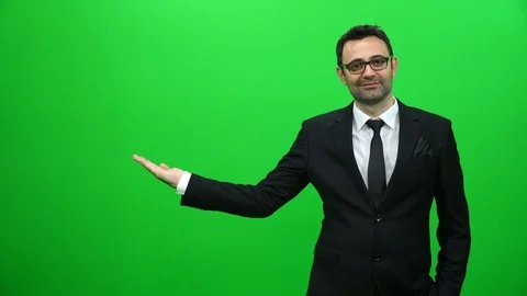 Businessman Lifting Or Presenting Something on Green Screen. Right Side. Stock Footage 88651686