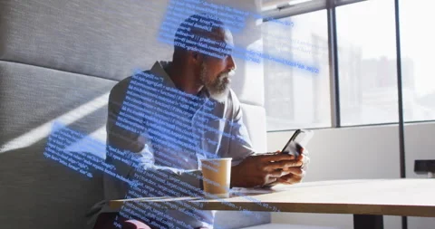 Businessman lifting smartphone, scrolling as code lines sweep across him, gazing Stock Footage 315537895