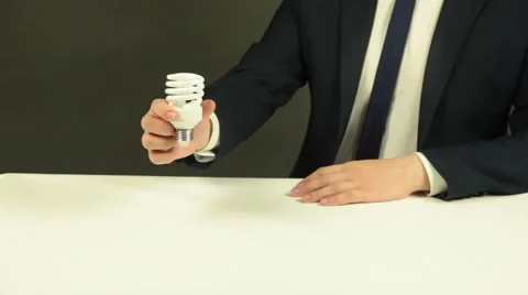 A Businessman with a Light Bulb Stock Footage 62344521