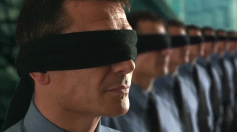 Businessman in a line-up removing his blindfold. Stock Footage