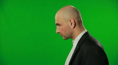 Businessman is looking up and down on a green screen.FULL HD. 動画素材 41999249