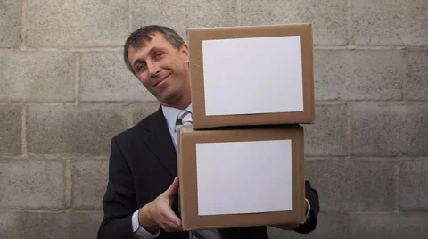 Businessman Looking From Behind Boxes Stock Footage 64076764