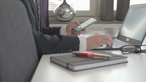 Businessman looking at data graphs on his compute Stock Footage 82724144