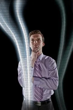 Businessman looking at data streams Foto stock