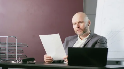 Businessman Looking at a Document With Resignation Stock Footage 73125110