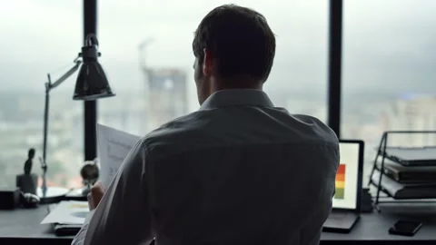 Businessman looking at documents in office. Man having stress at work Stock Footage 137285158
