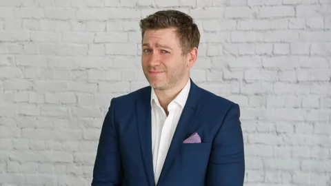 A businessman looking doubtful about a suspicious proposal of a dubious Stock Footage 201019778
