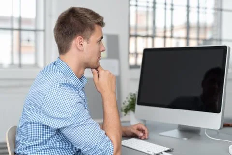 Businessman Looking at his Reflection on Computer Stock Photos