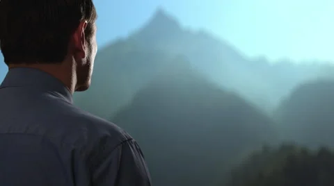 Businessman looking up at mountain. Stock Footage 43632936
