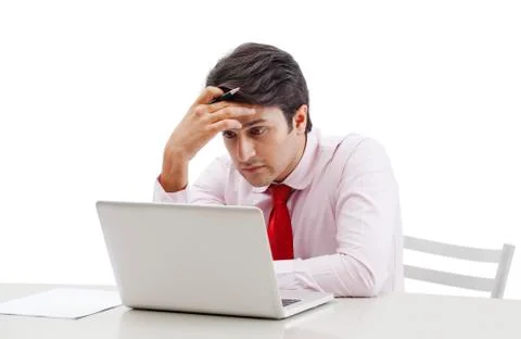 Businessman looking sad while working on a laptop Stock Photos