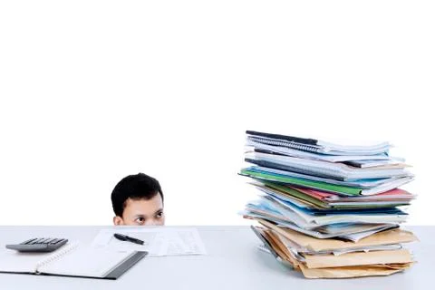 Businessman looking at stack of files Stock Photos