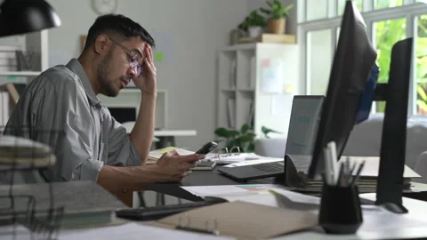 Businessman looking stressed while using phone Stock Footage 317751999
