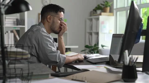 Businessman looking stressed from work, Tired businessman working at office Stock Footage 317752004