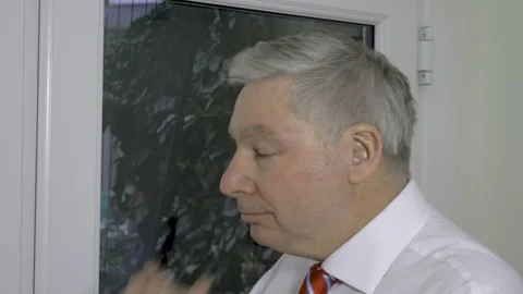 Businessman looking thoughtful turns to face the camera	 Stock Footage 97159727