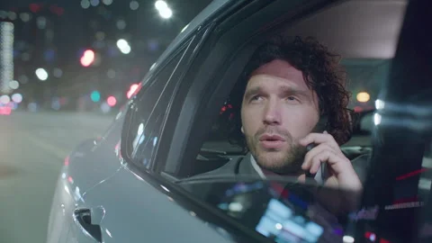 Businessman Looking through Car Window during Phone Conversation Stock Footage 314474902