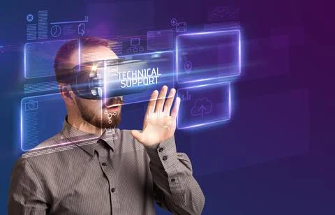 Businessman looking through Virtual Reality glasses, tech concept Stock Photos