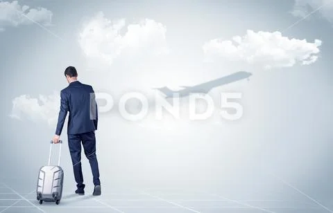 Businessman with luggage look to an airplane Stock Photos