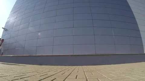 Businessman make a tricks and flips near office parking Stock Footage 67343573