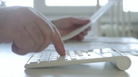 Businessman Makes Calculations Using Adding Machine, Checking Payments Papers. Stock Footage 153151364