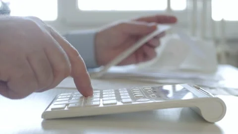 Businessman, Makes Financial Calculations with Adding Machine. Stock Footage 161302674