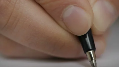 Businessman makes a note in notebook. Extreme close up of male business hand  Video stock 119057165