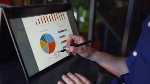 Businessman makes a presentation using stylus and convertible laptop with Stock-Footage 122766791