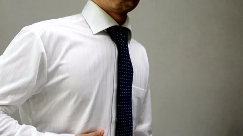 A businessman makes a sign language gesture indicating he doesn't understand. Stock Footage 335800683