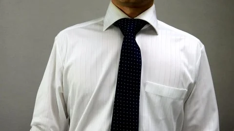 A businessman makes a sign language gesture indicating he doesn't understand. Stock Footage 335801340