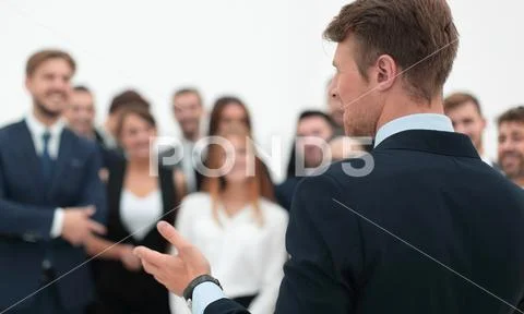 Businessman makes a speech to his team. Stock Photos