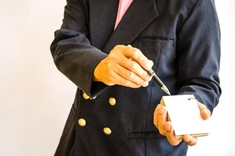 Businessman making notes on the paper Stock Photos