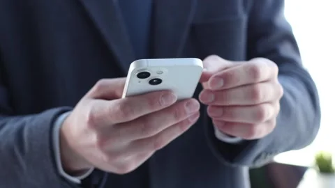 A businessman man in a close-up in a jacket talking using a phone Vidéo 263931216