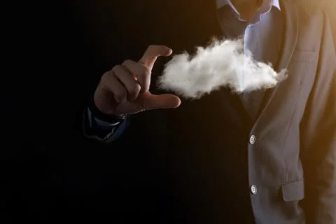 Businessman man hand holding cloud.Cloud computing concept, close up of young Stock Photos