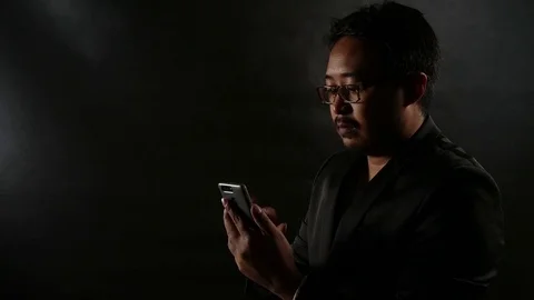 Businessman man using smartphone Browsing and Text Messaging Stock Footage 78467354