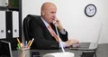 Businessman in Manager Office Use Computer and Talk to Telephone Line 4k or 4k+ Resolution