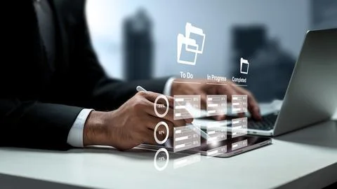Businessman managing workflows on a digital tablet with virtual task manage.. 스톡 사진