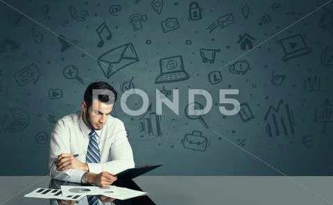 Businessman with media icons background Stock Photos