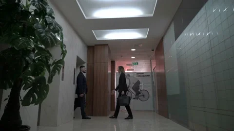 Businessman meeting visiting client at elevator hall. Video stock 133547312