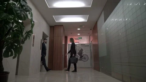 Businessman meeting visiting client at elevator hall. Video stock 133547375