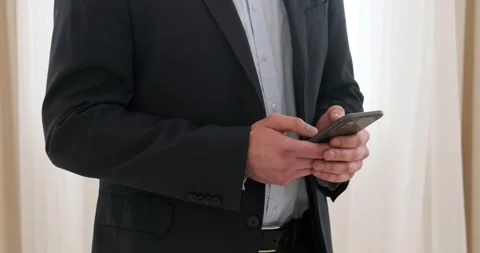 Businessman messaging using mobile phone Stock Footage 239453260