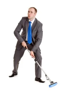 Businessman with a mop Stock Photos