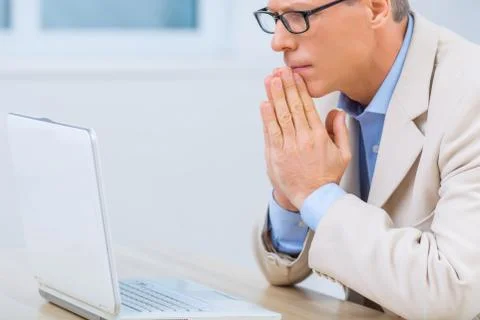 Businessman nervously expects problem resolution 写真素材